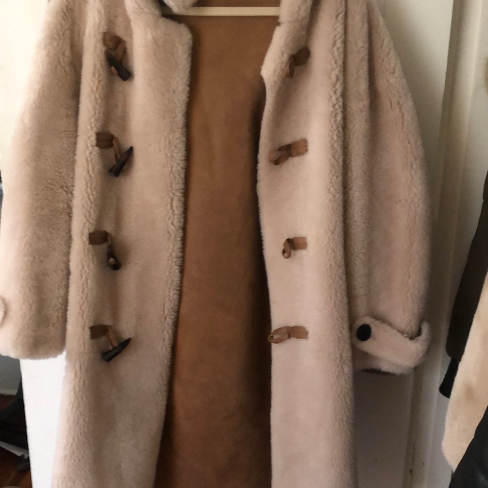 Fur coat with leather inside. Super warm. Got in Korea